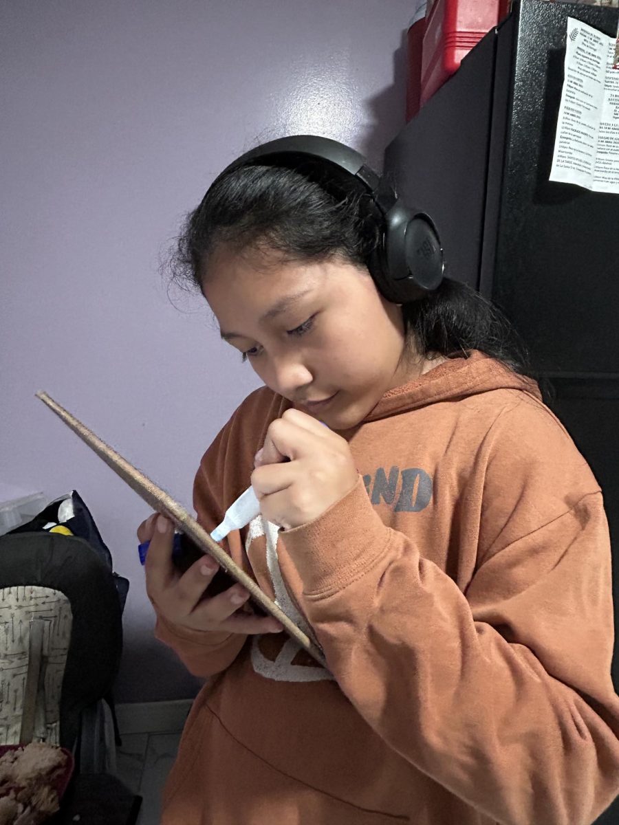 Angelina Mateo draws on her board since she really loves to draw.
