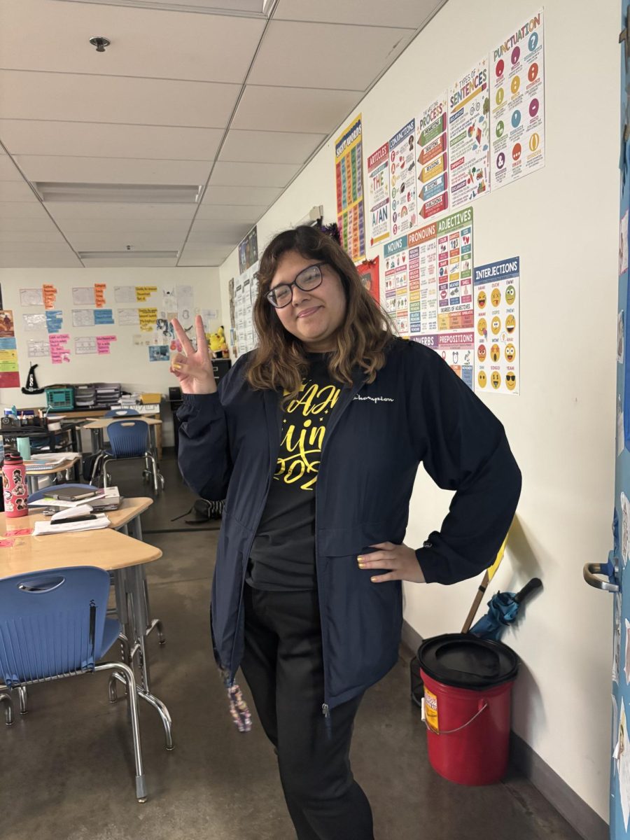Ms Rameriez  smiles in her class