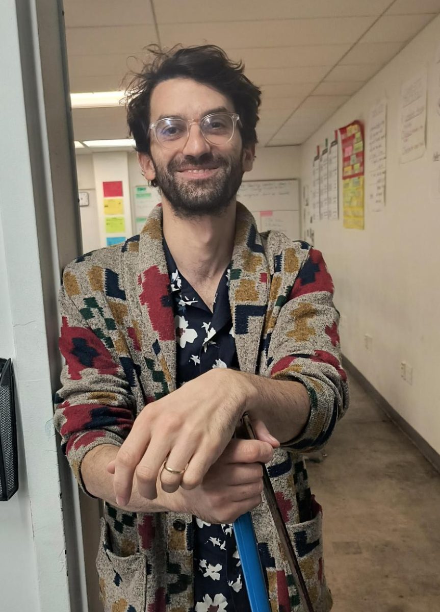 Mr. Farkas poses for a photo in the hallway.