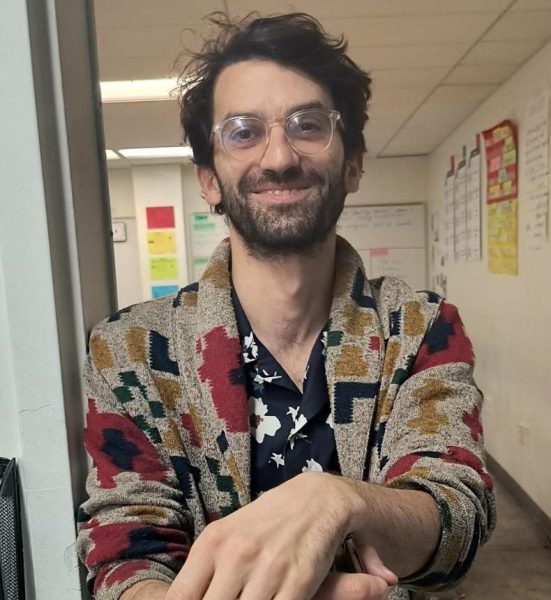 Mr. Farkas poses for a photo in the hallway.