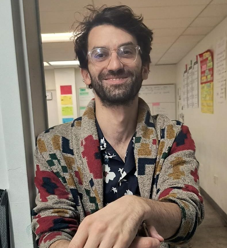 Mr. Farkas poses for a photo in the hallway.