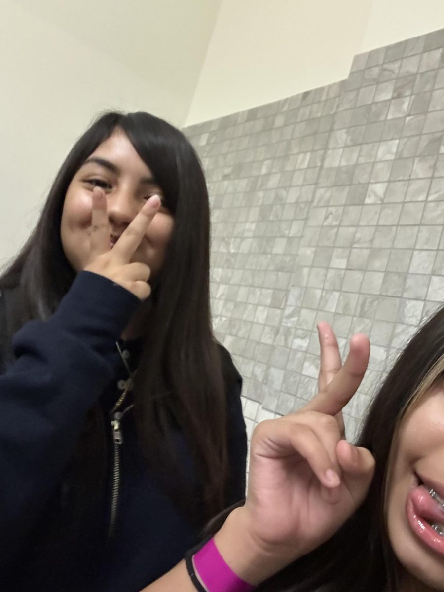 Arlene Reyes and Hayden Cardenas pose for a picture.