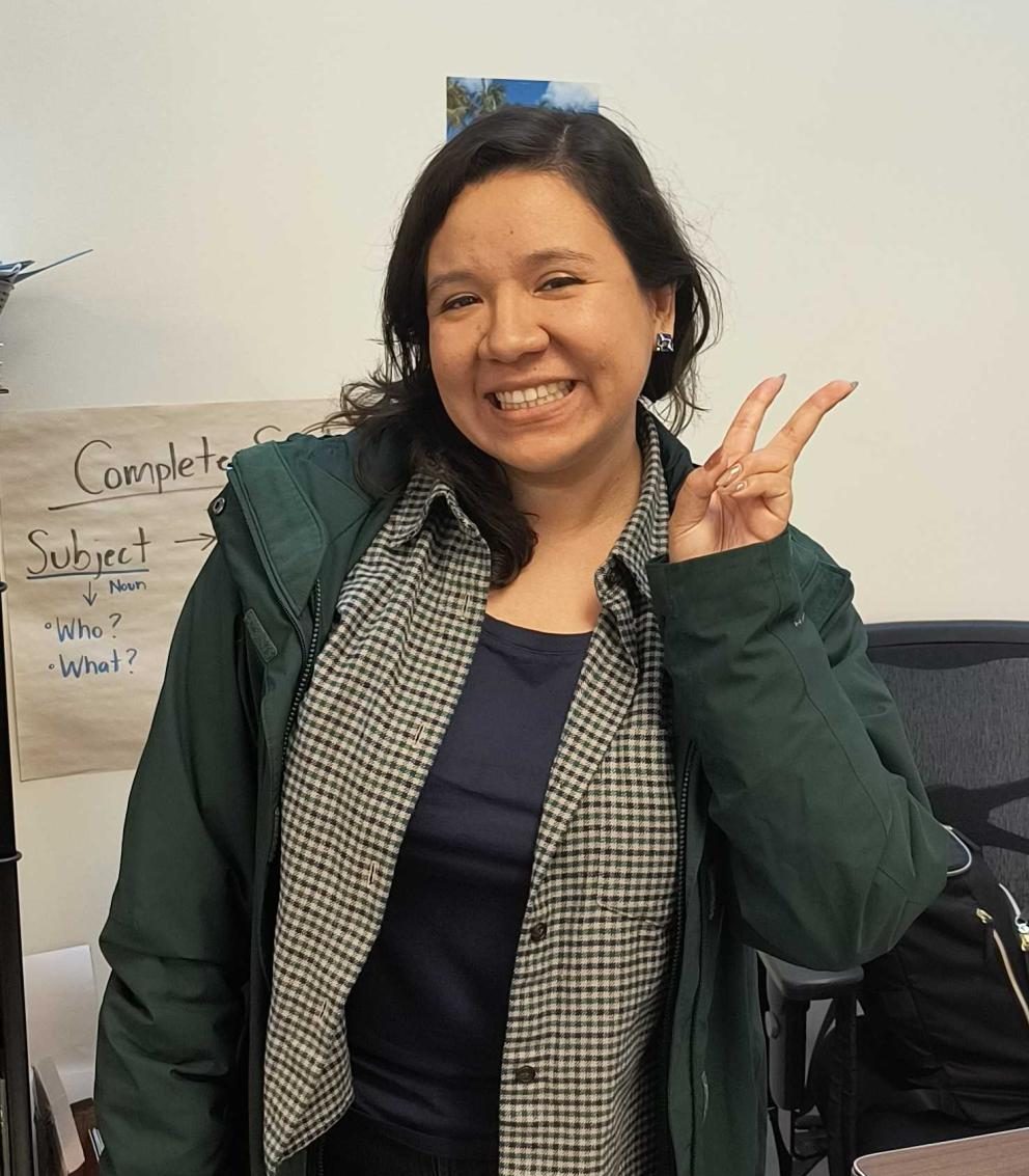 Ms.Briseño poses for a photo after school in her classroom.