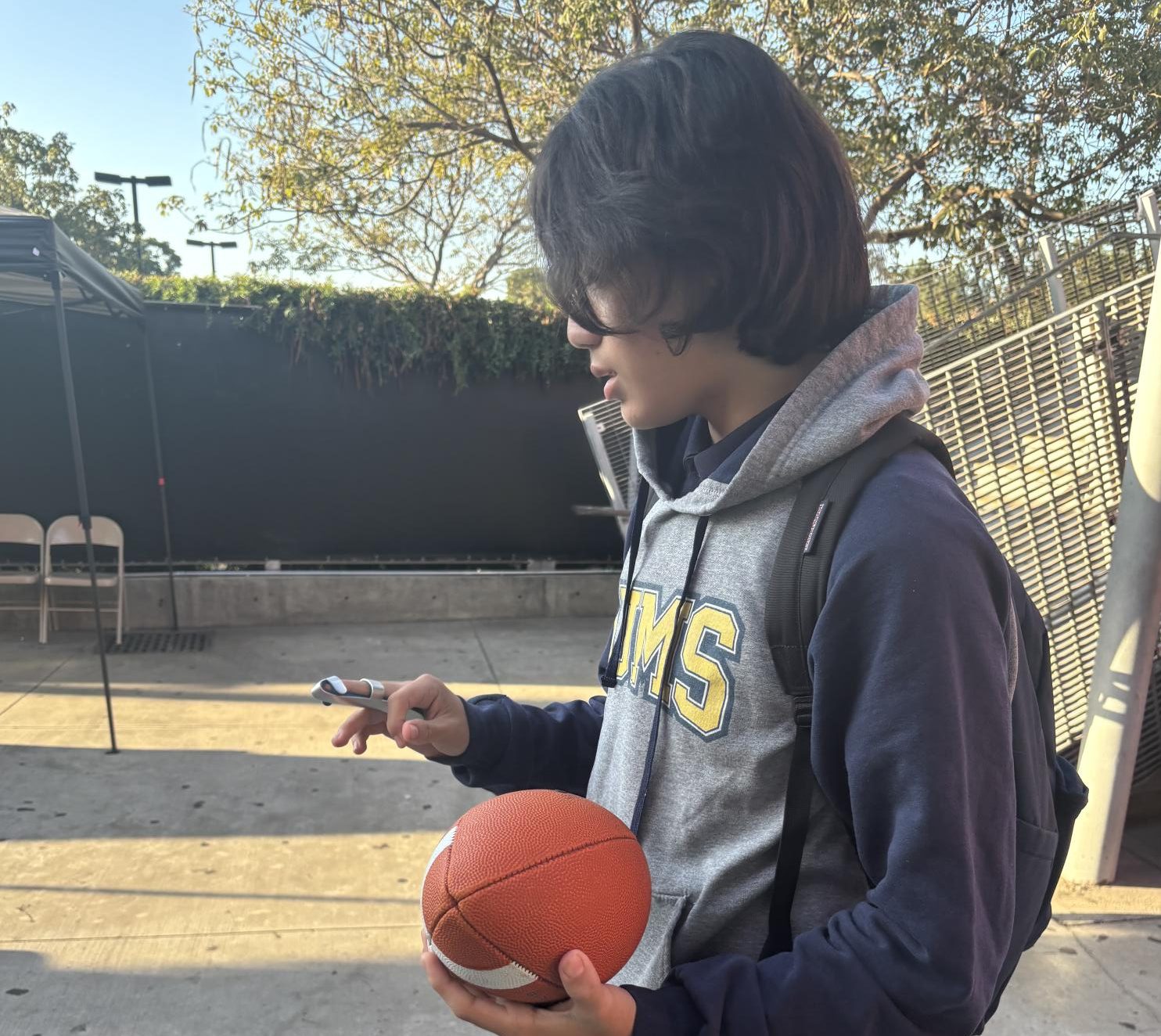 Nickolas just caught a ball that was thrown by Jose.