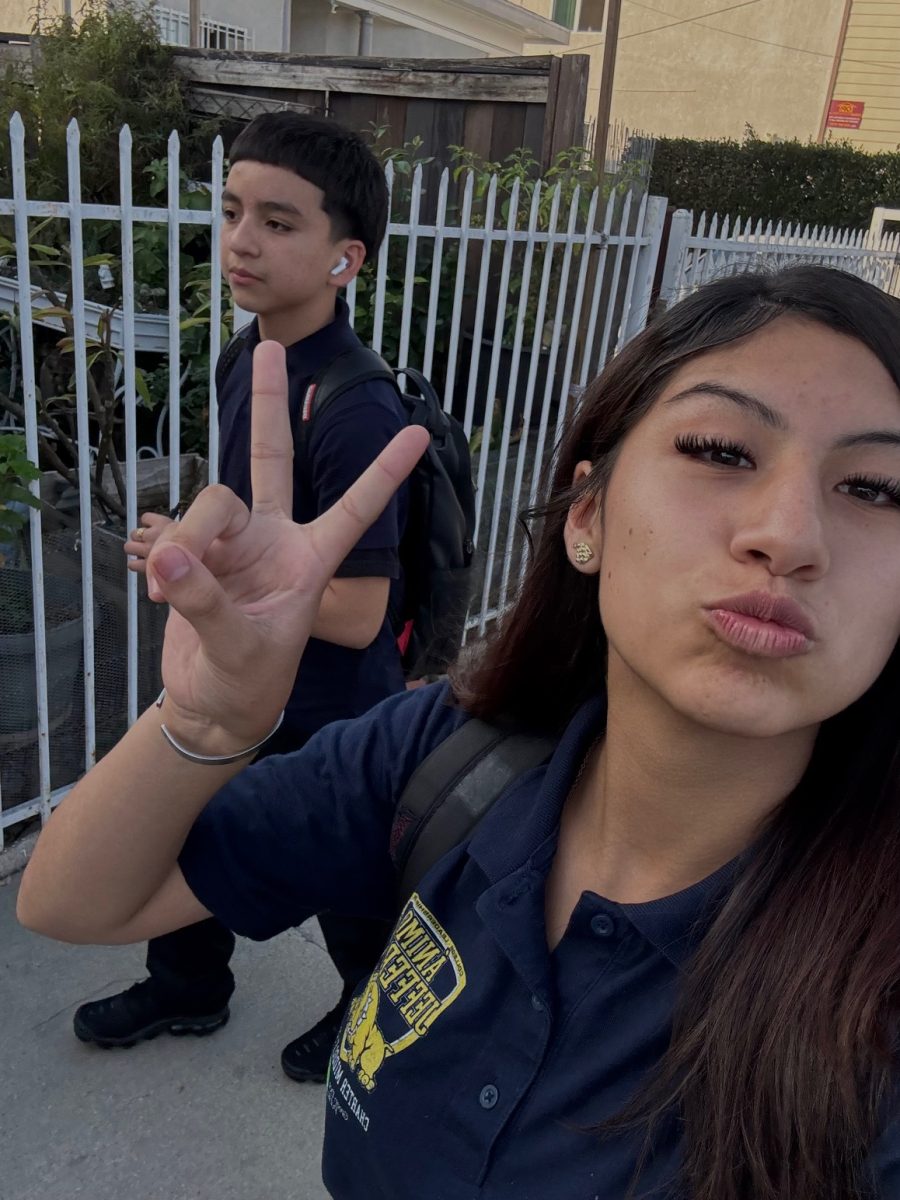 Gabby takes a photo with her bestfriend while walking home.