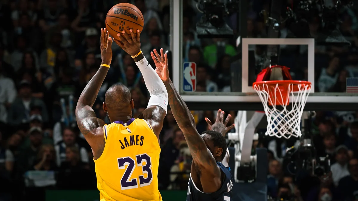 Lebron about to shoot a three pointer.