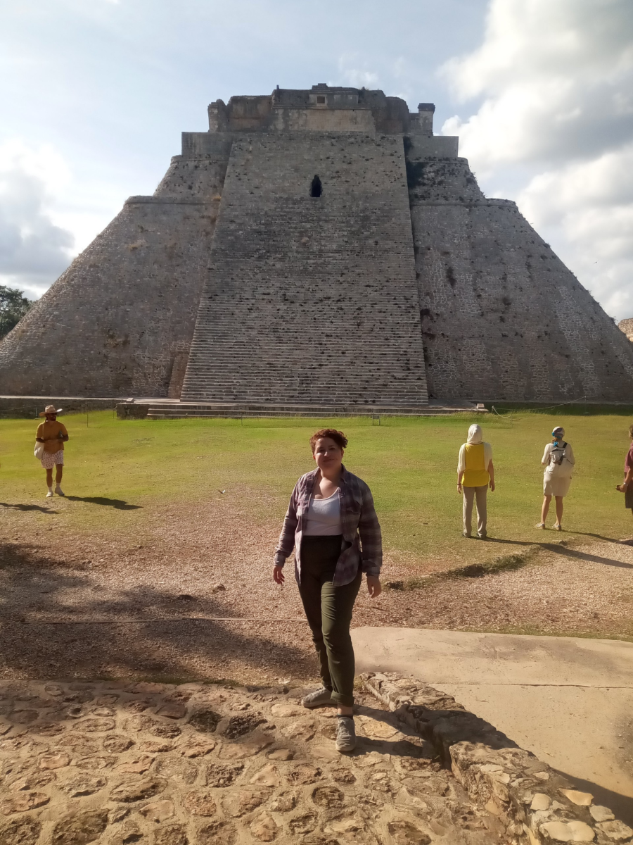 Ms. Ortiz poses in front of a pyramid in Mexico