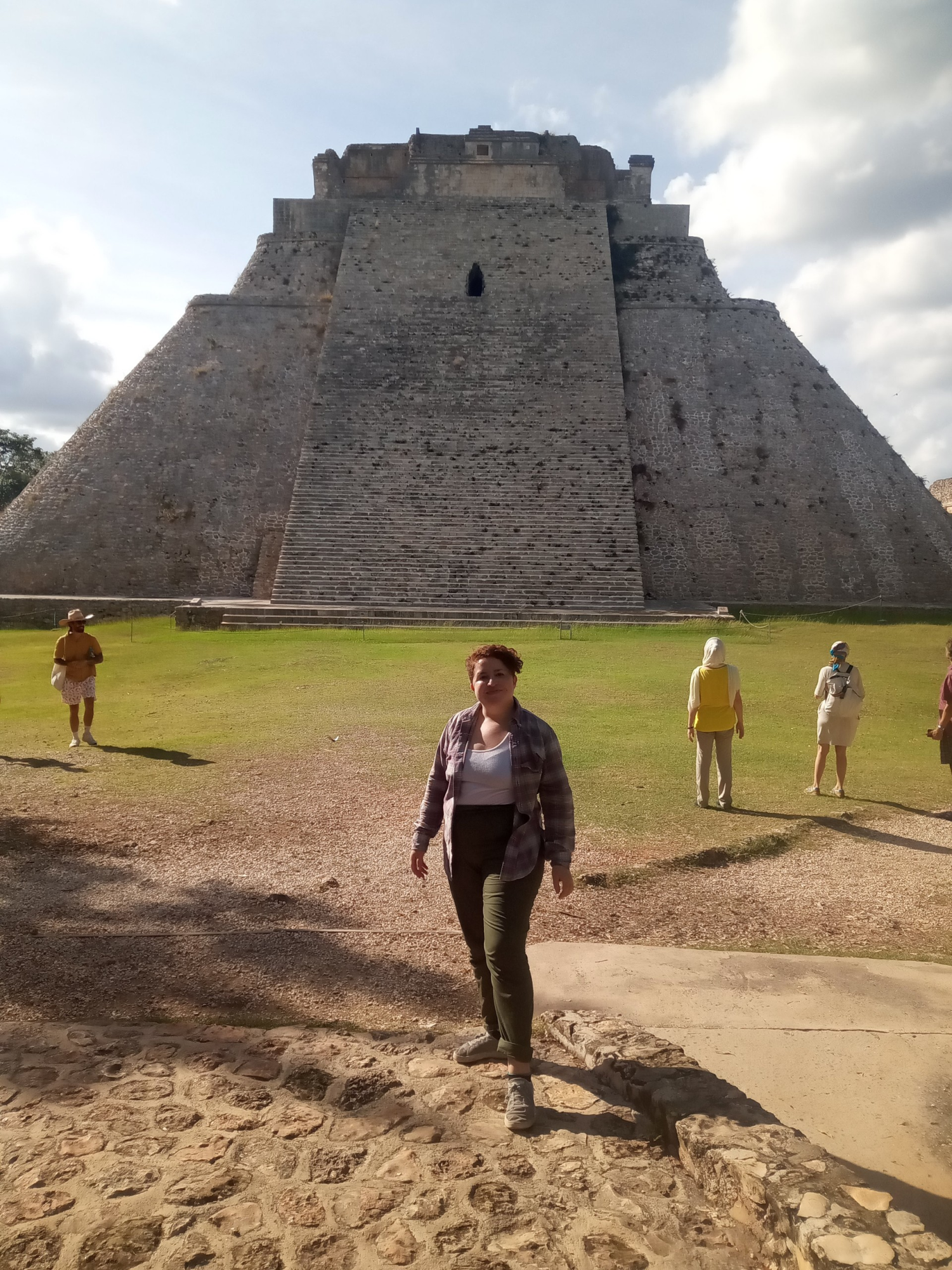 Ms. Ortiz poses in front of a pyramid in Mexico