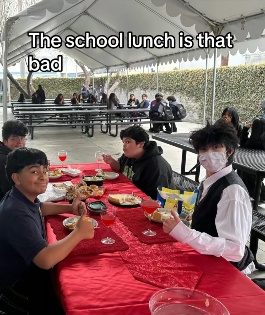 Fernando eating food with his friends
(He's the kid in the top left of the table)
