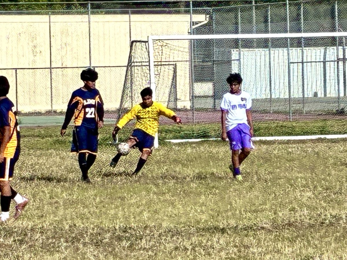 Abraham Marcellez kicking the soccer ball.
