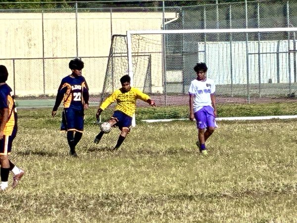 Abraham Marcellez kicking the soccer ball.
