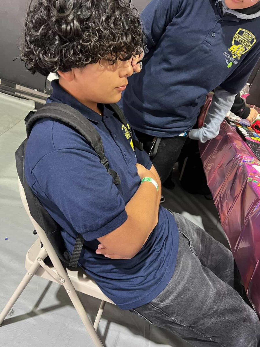 Kevin sitting with his arm crossed in the gym.