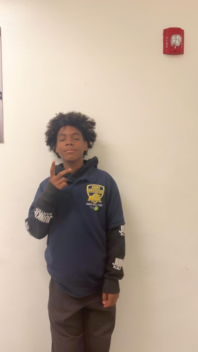Daniel posing for a picture in the hallway.