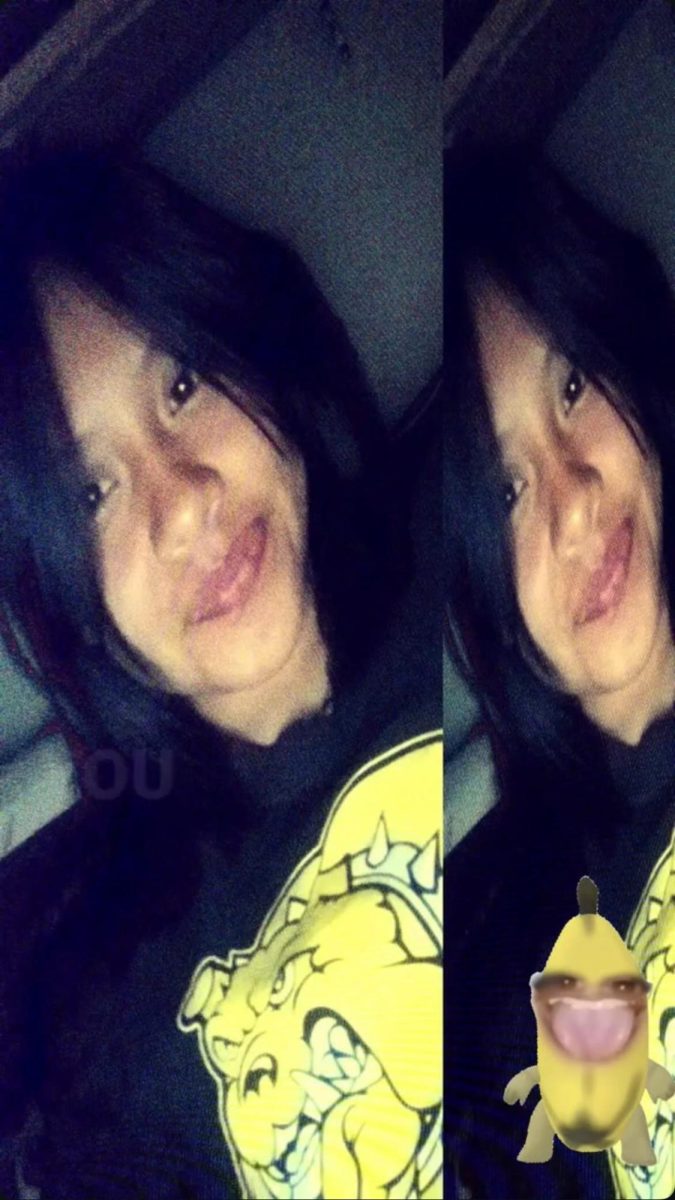 Janett taking photo of herself.