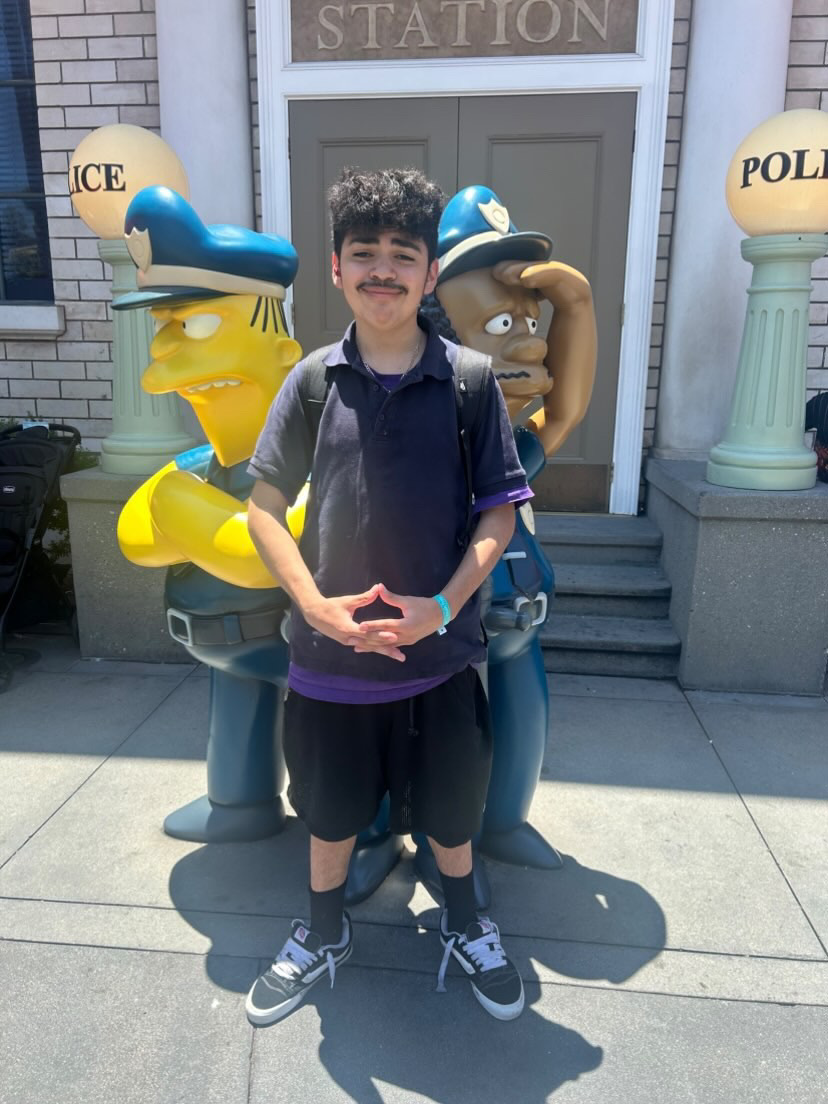 Aiden poses for a picture at Universal Studios.