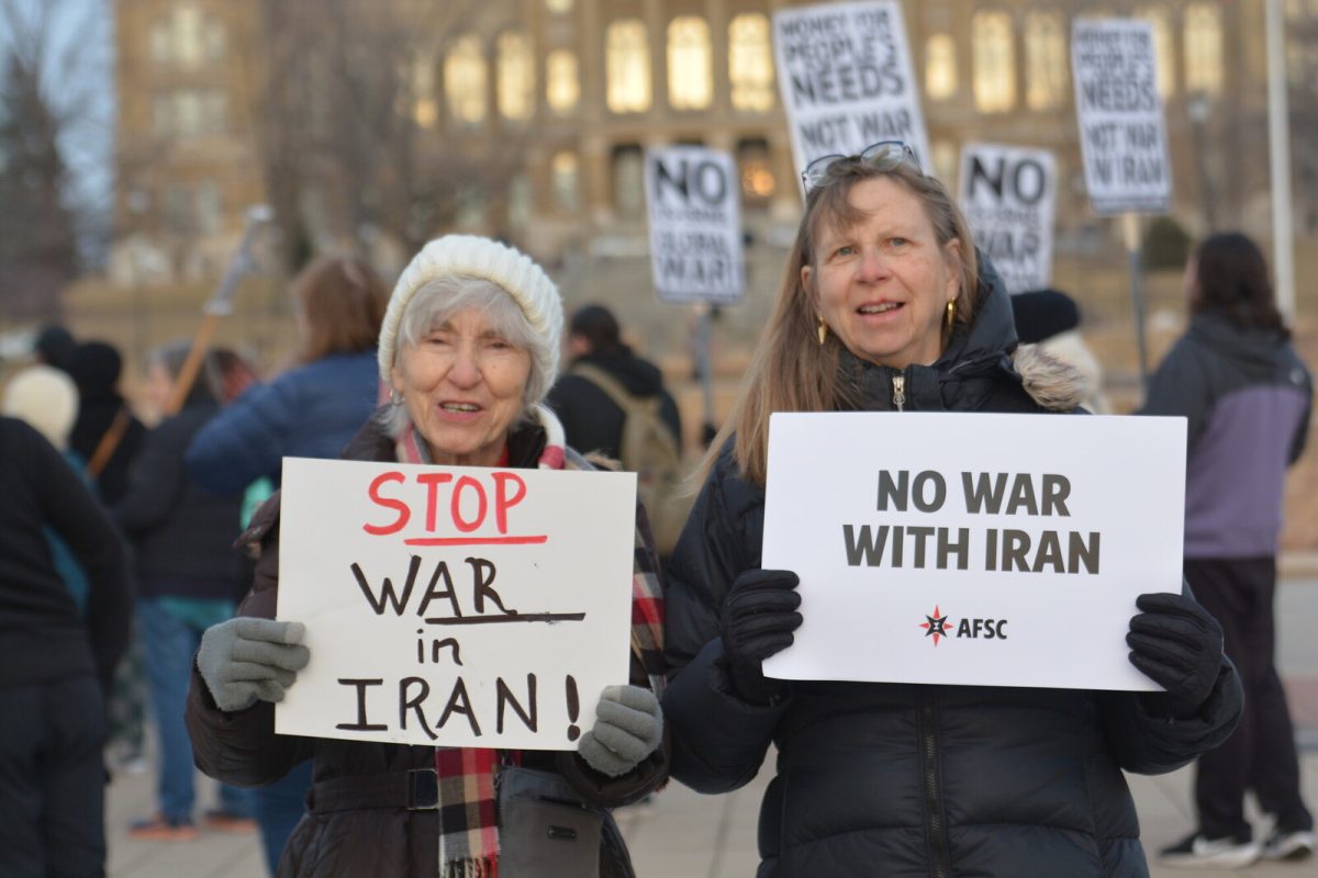 People protesting to stop the Iran War.

