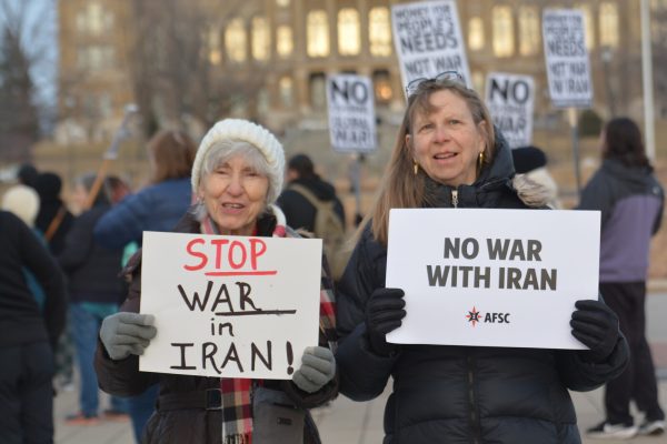 People protesting to stop the Iran War.

